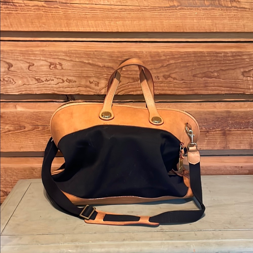 Dooney & Bourke Black and Tan Travel Companion